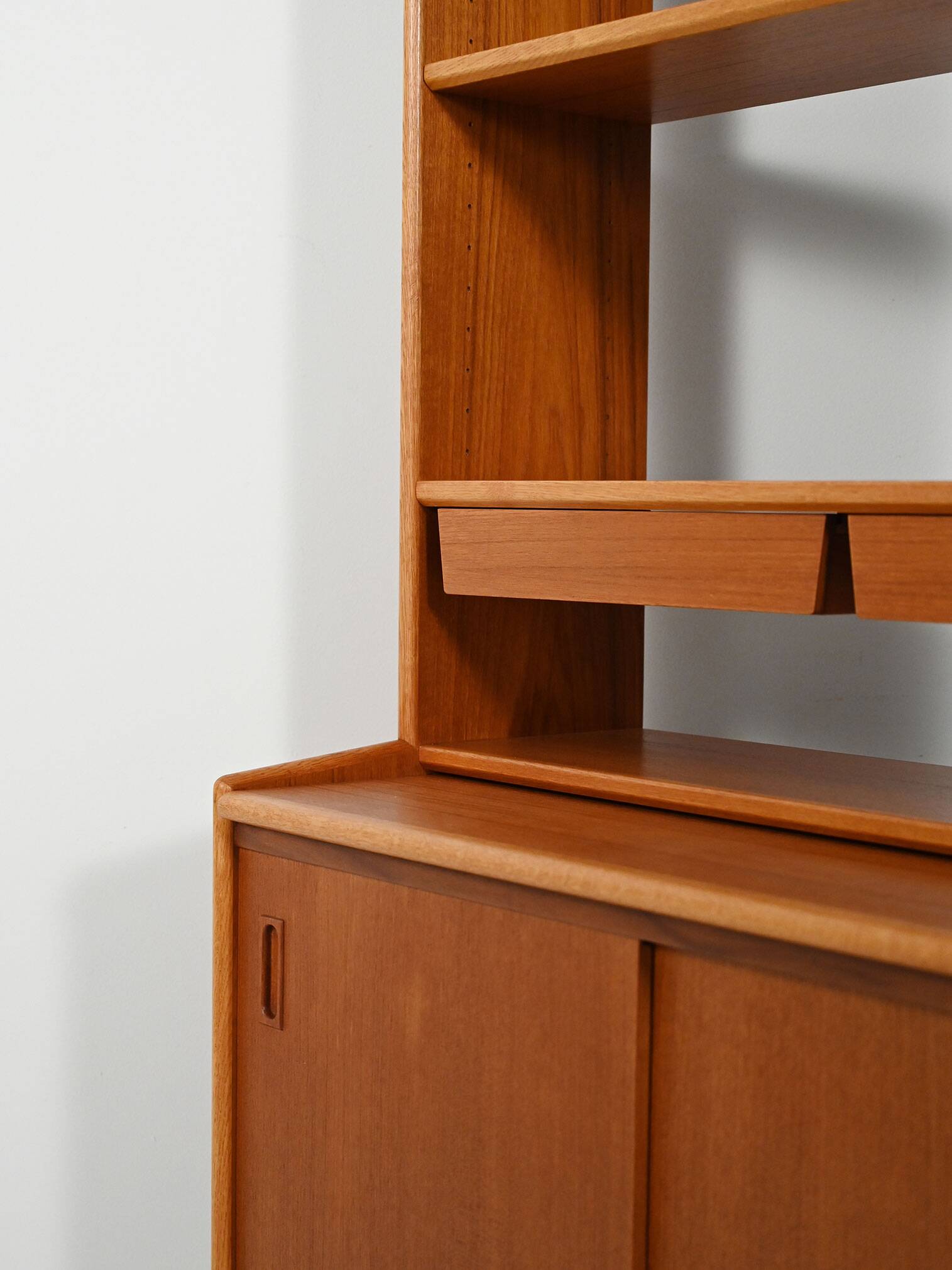 Scandinavian teak bookcase with suspended drawers