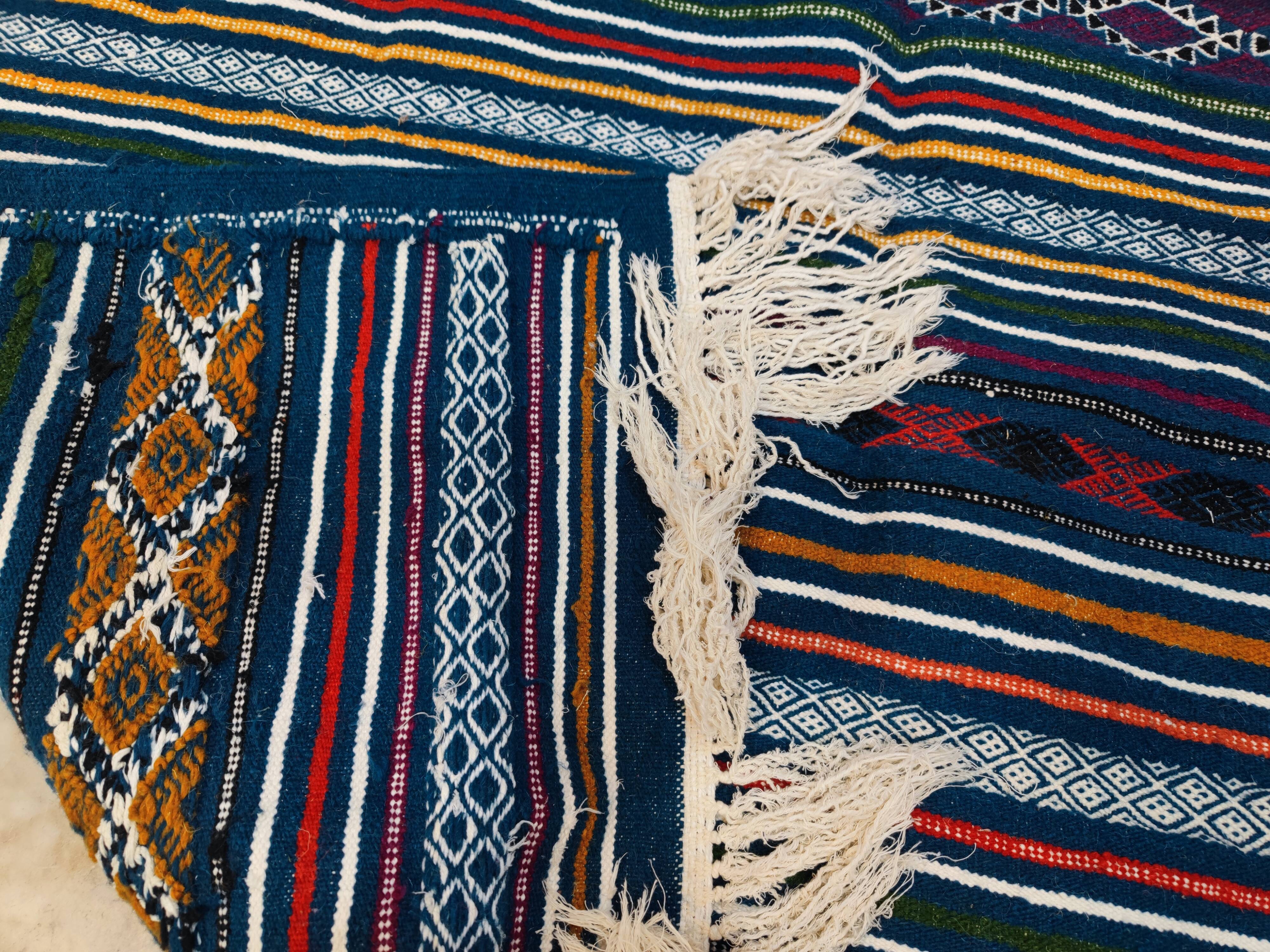 Handwoven blue kilim rug in natural wool