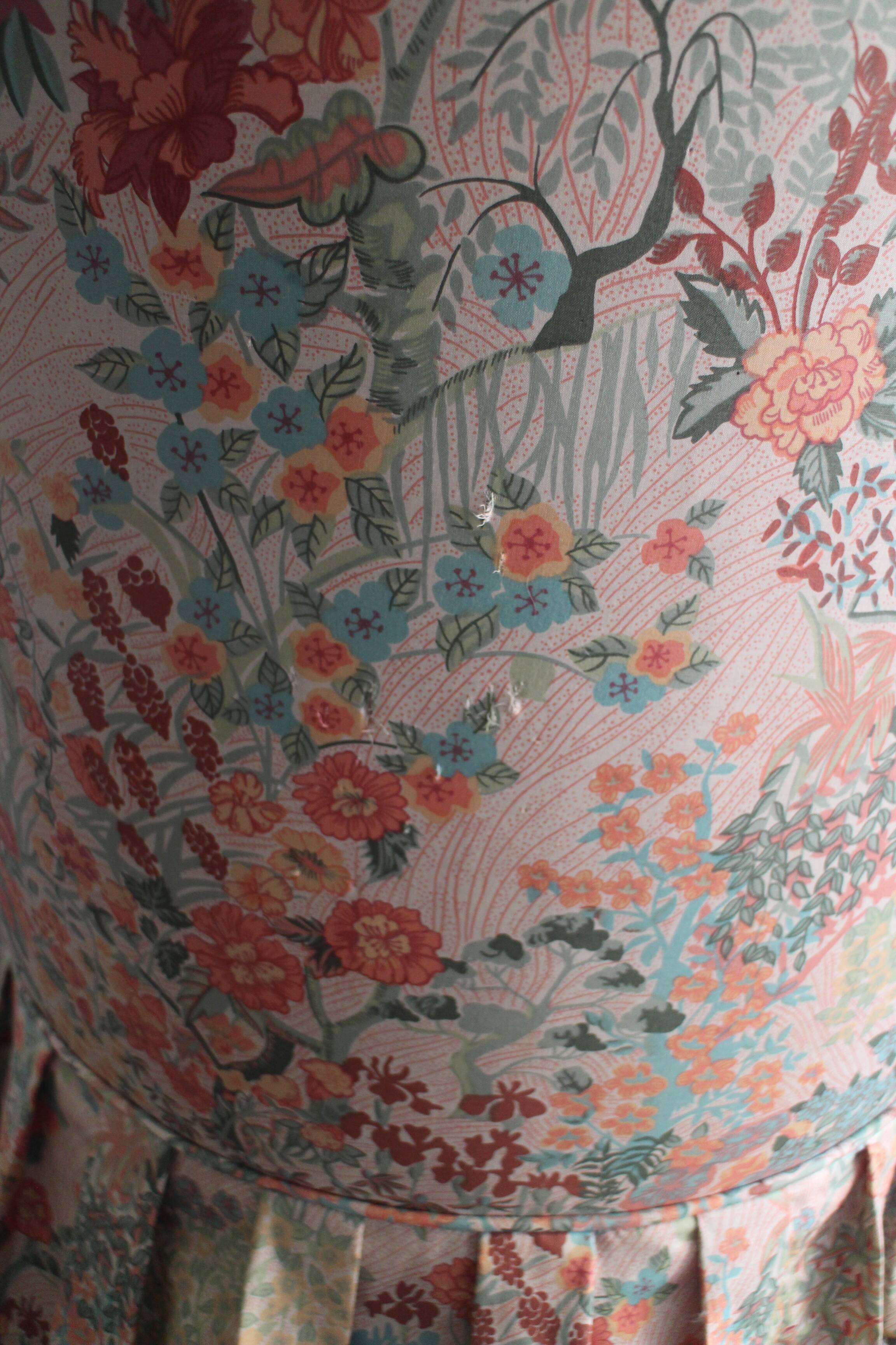 pair of toad armchairs in floral fabric.