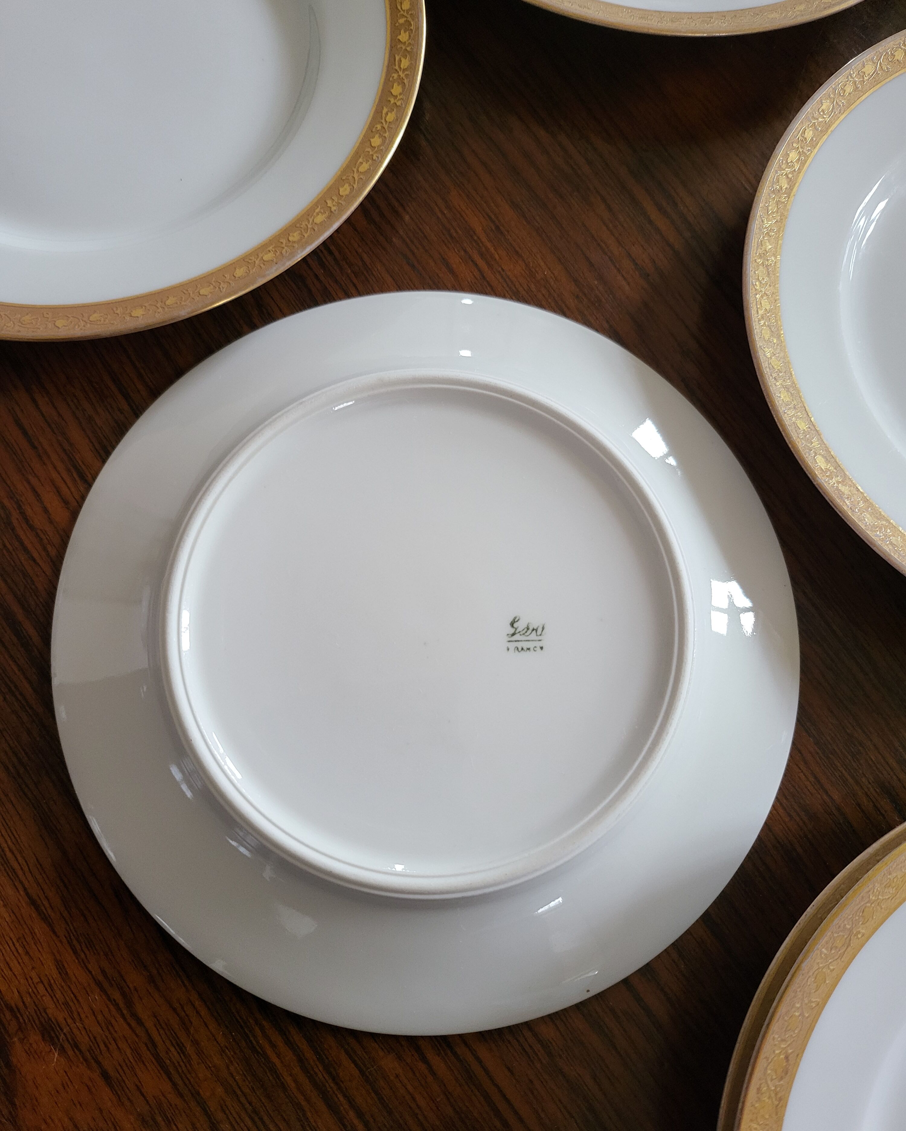 Lot of 8 small porcelain bread plates.