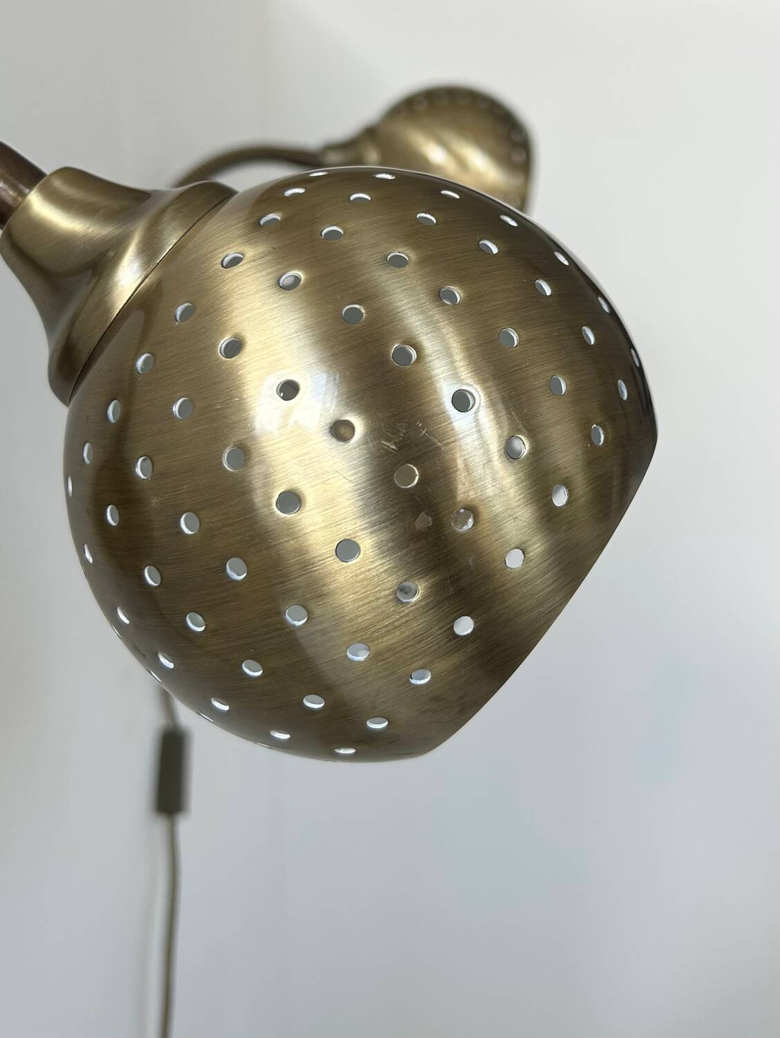 Pair of vintage adjustable wall lights, perforated brass, Sweden 1960