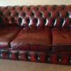 Three-seater burgundy burgundy leather chesterfield sofa