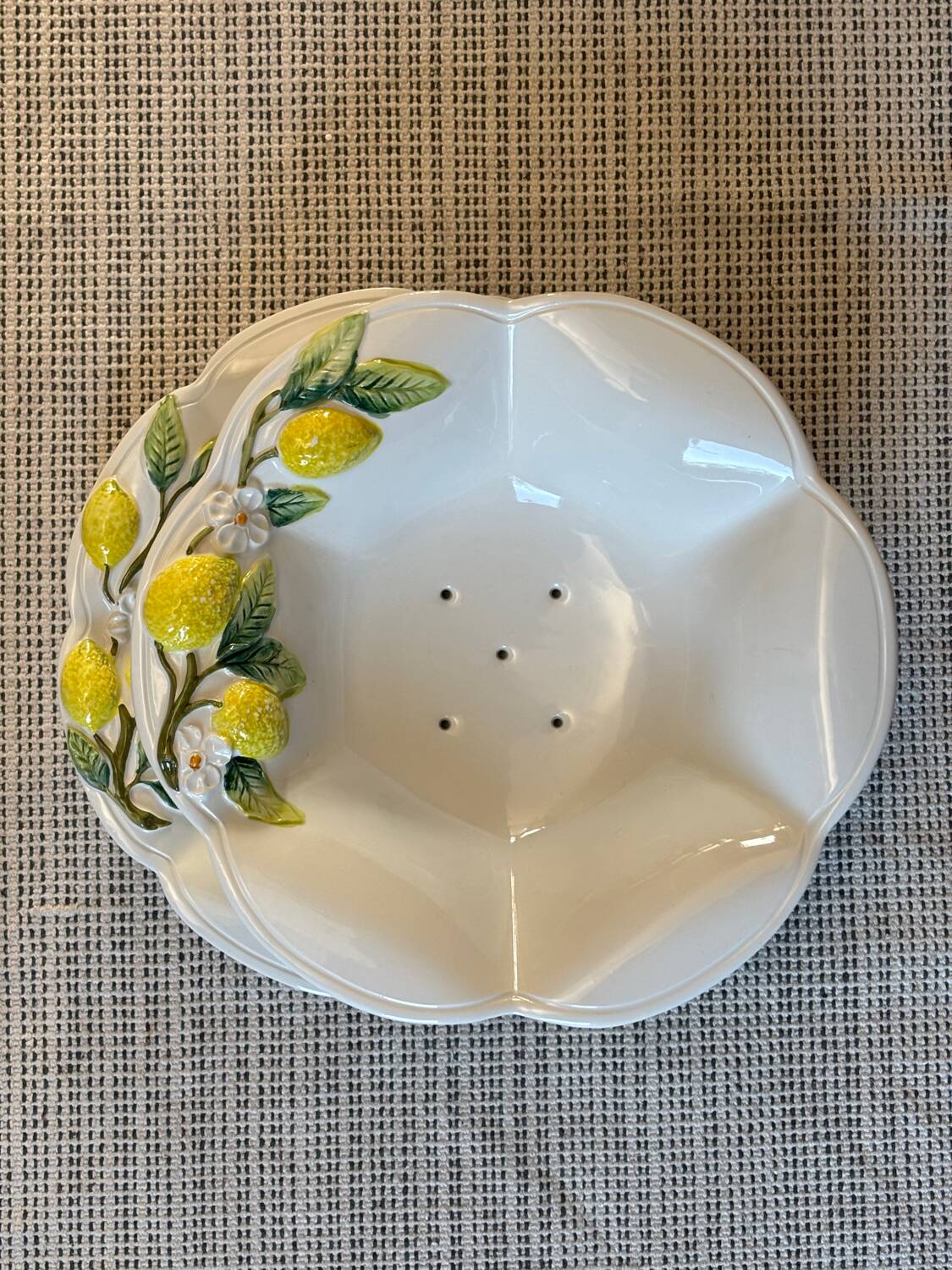 Plate and colander of lemons in slipware