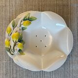 Plate and colander of lemons in slipware