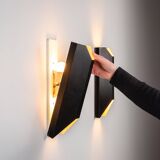 Architectural pair of vintage black metal wall lamps with angular geometric