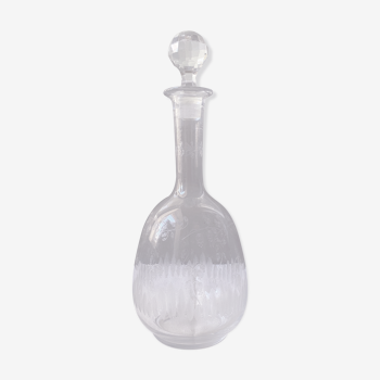 Carved glass decanter with floral decorations