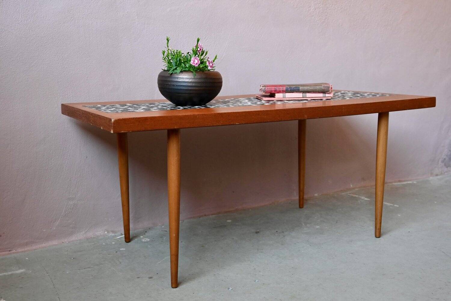 1970s coffee table with a tapered teak base and ceramic mosaic.