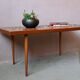 1970s coffee table with a tapered teak base and ceramic mosaic.