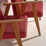 2 red armchairs, circa 1960