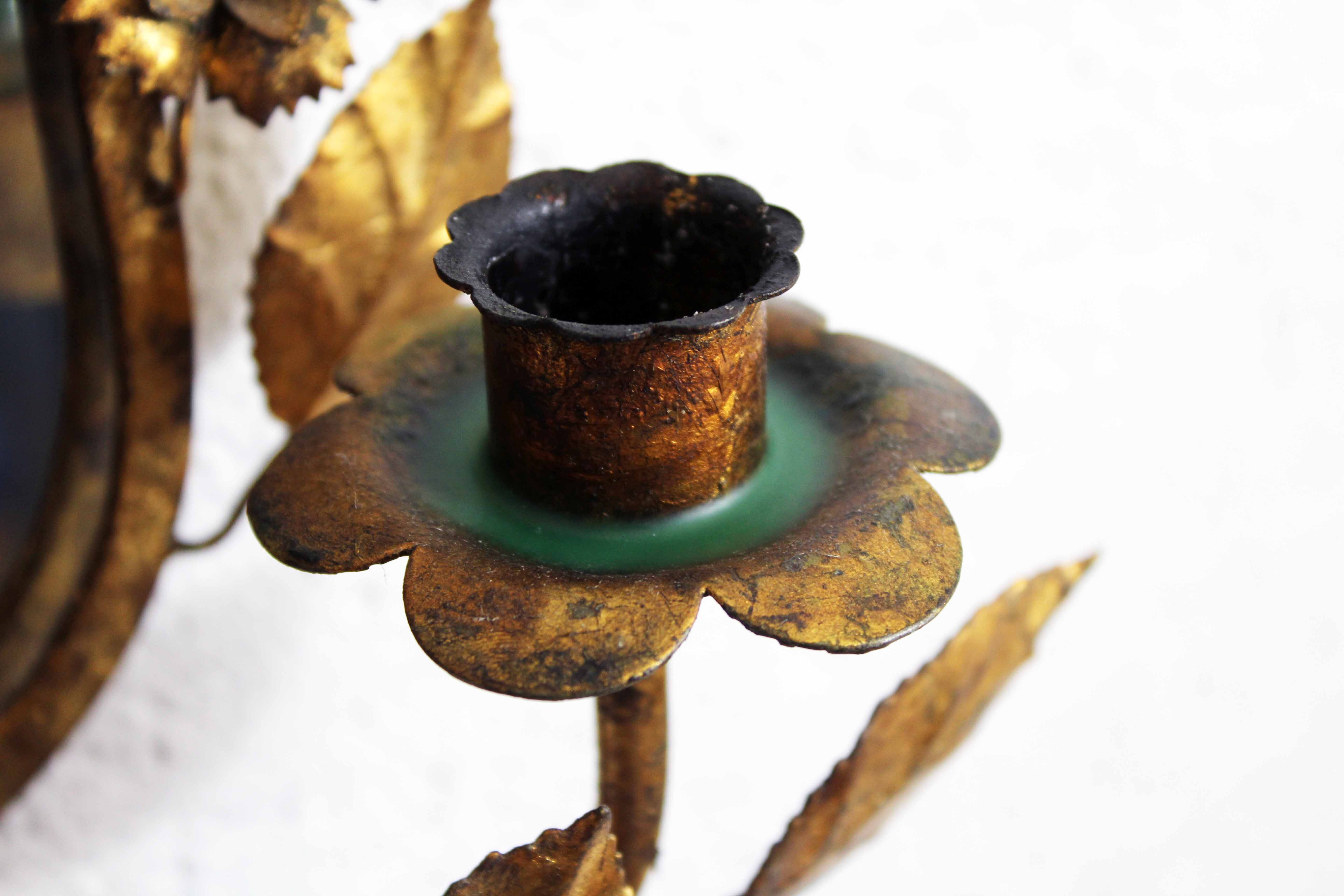 Old candlestick mirror gilded with leaf