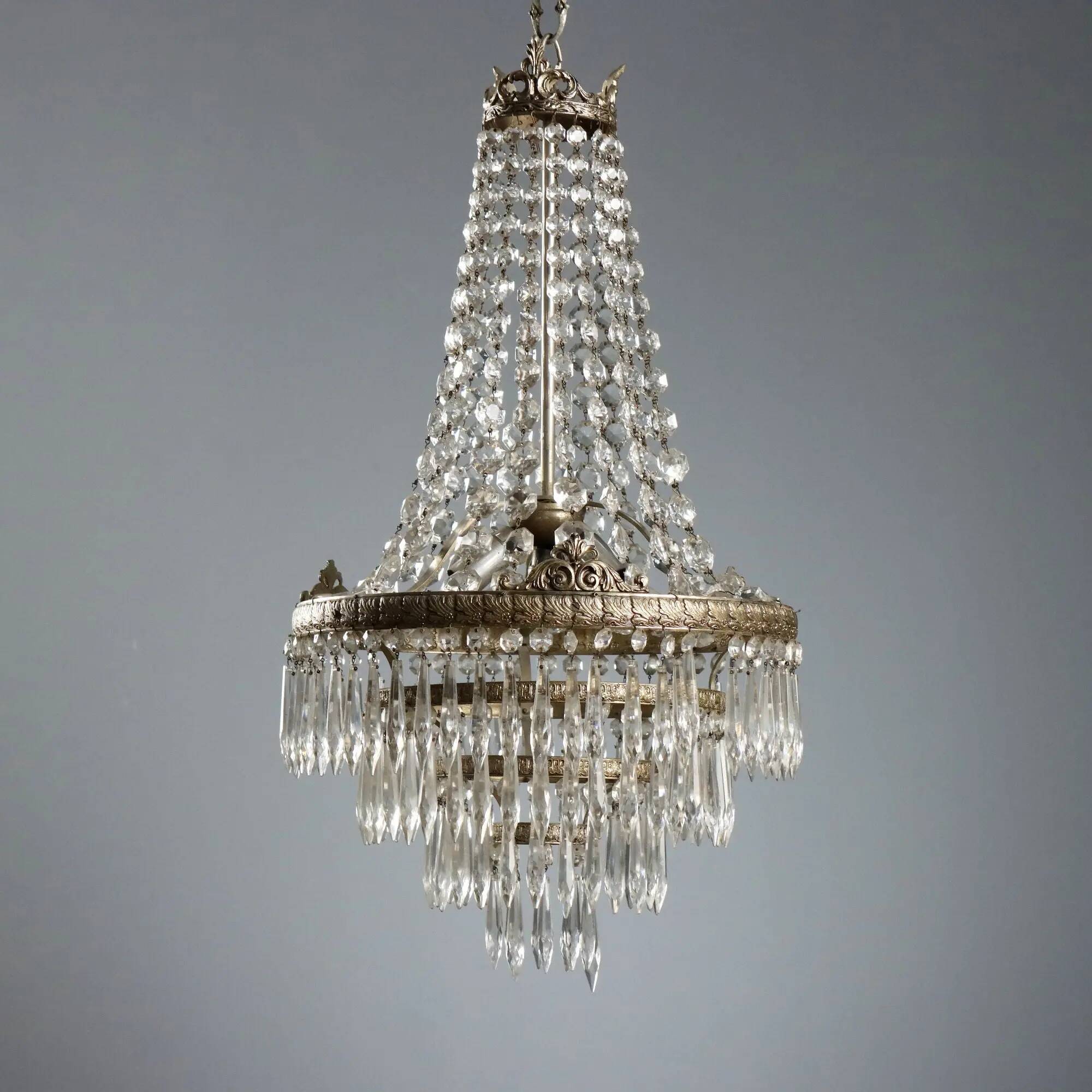 Antique chandelier in the shape of a balloon in silver-plated metal and glass, 20th century.