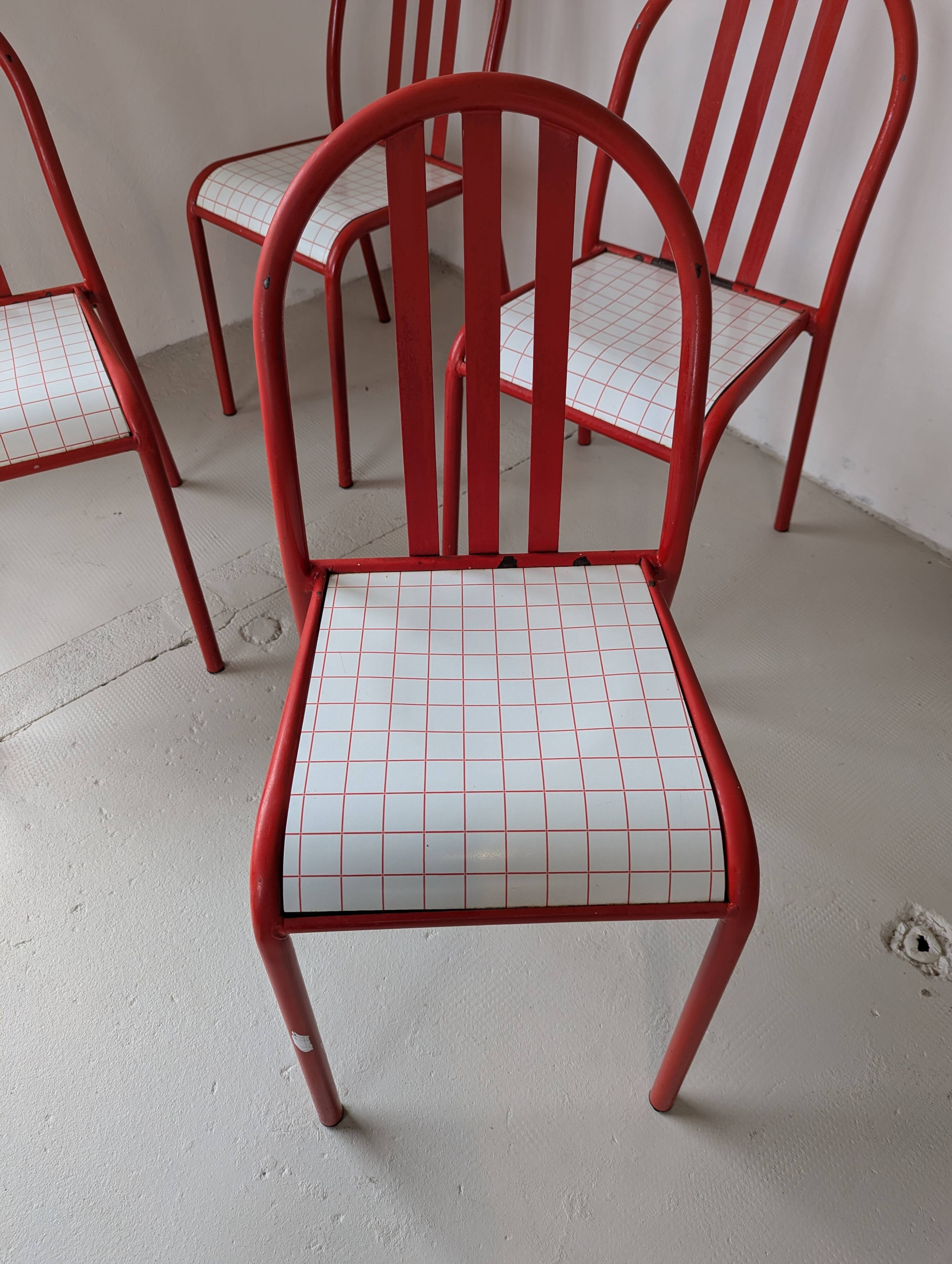 Set of 4 modernist red metal chairs