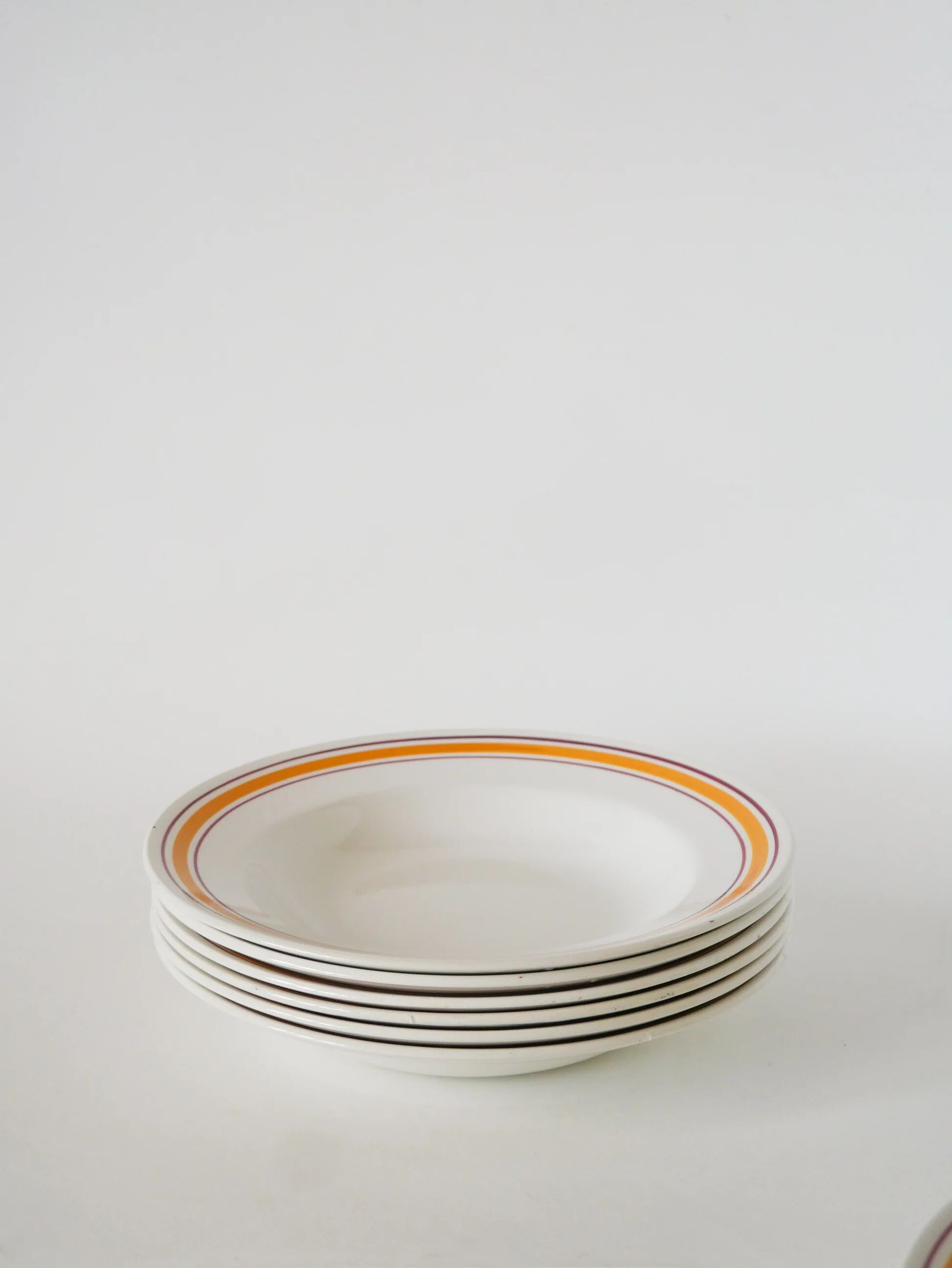 Set of 6 deep plates, yellow and burgundy borders, 1960.
