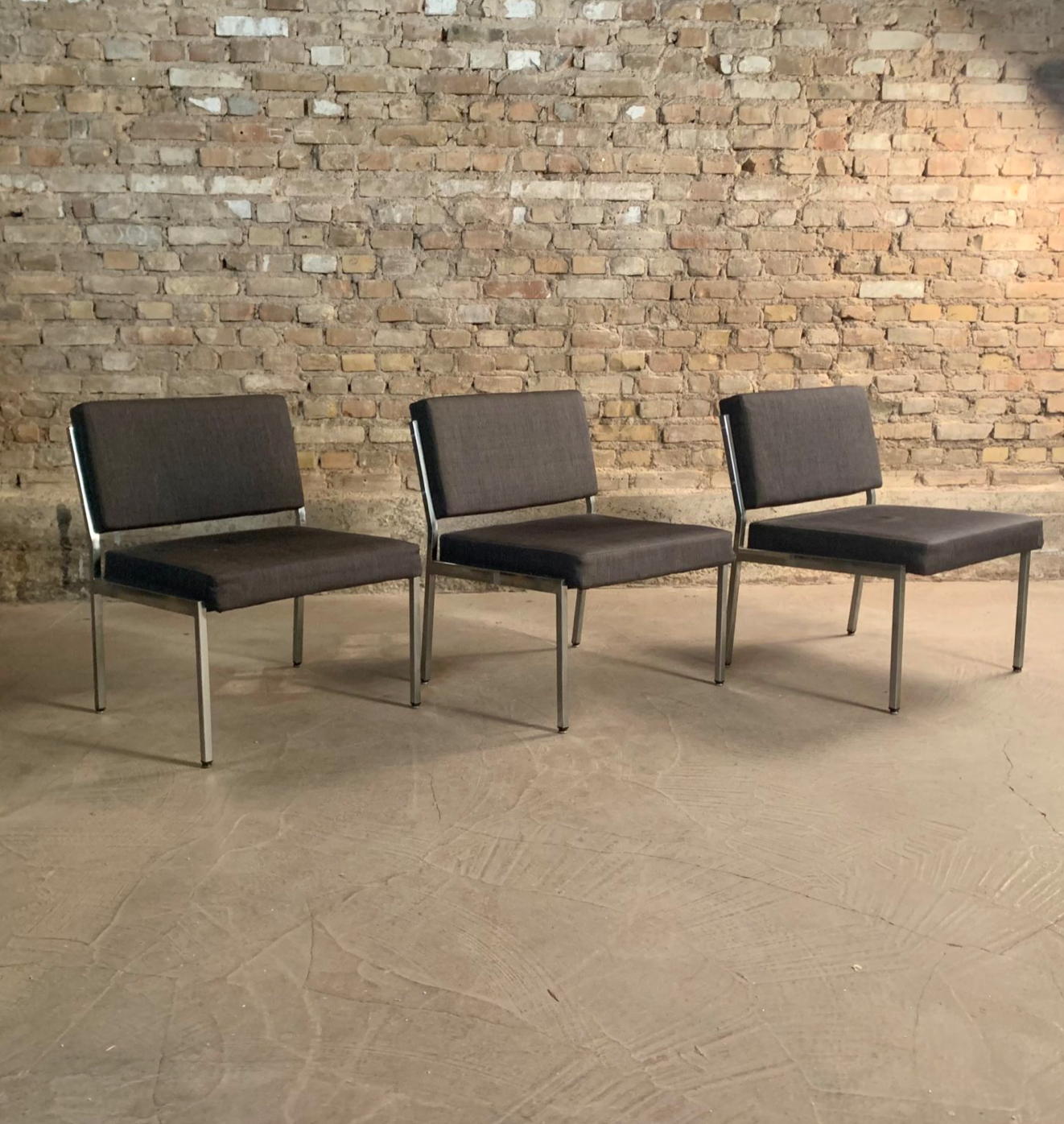 Armchair in metal and grey fabric