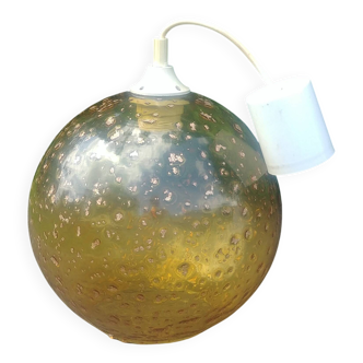 A vintage 70s blown glass pendant light with gold glitter in a globe shape