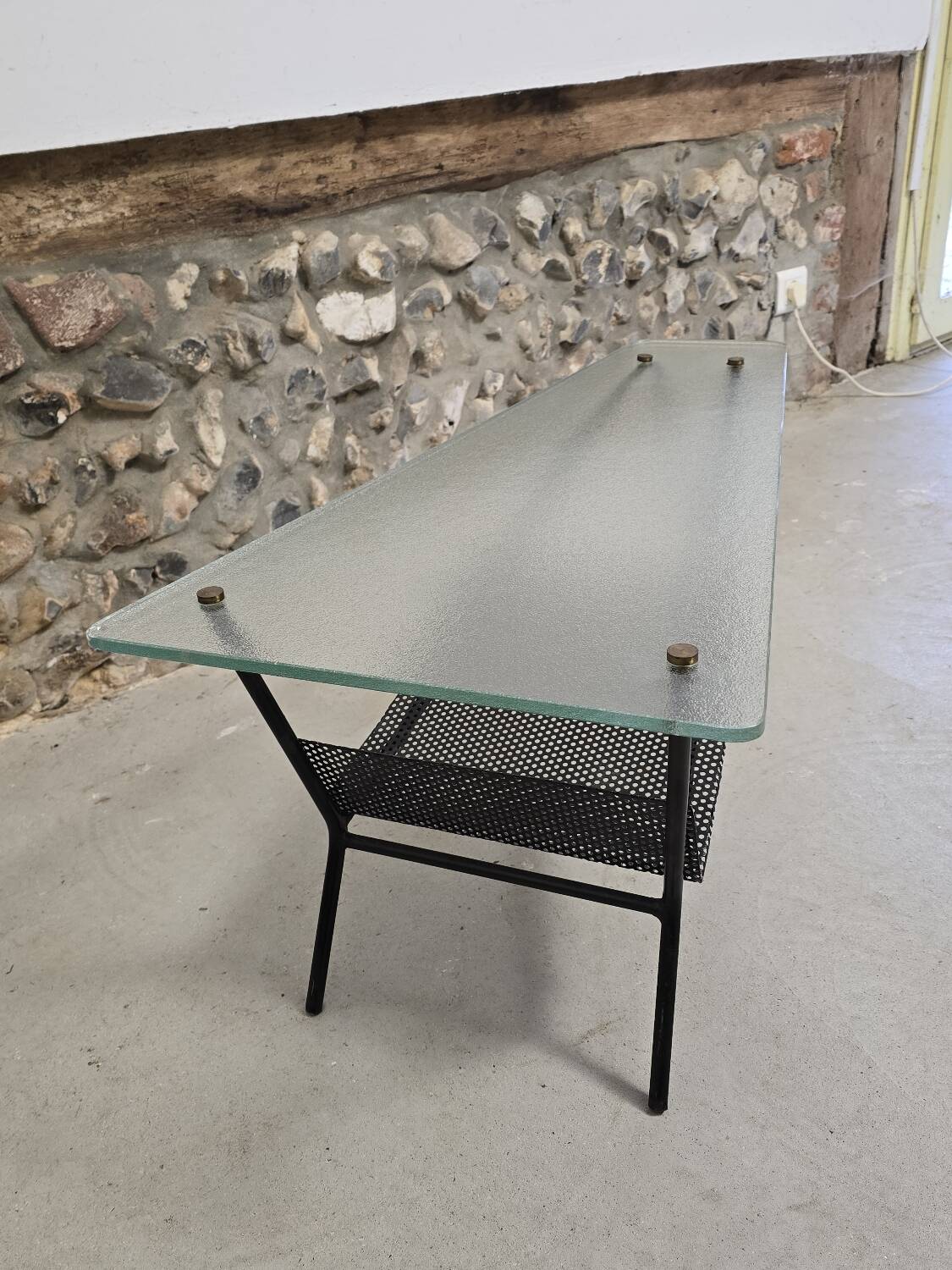 Coffee table in glass and black lacquered metal