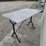 Antique cast iron and marble bistro restaurant table