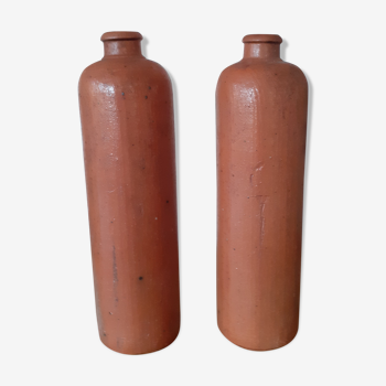 Pair of old sandstone bottles