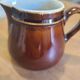 Brown ceramic milk jug