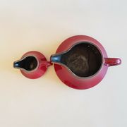 Teapot and milk jar in burgundy red ceramic