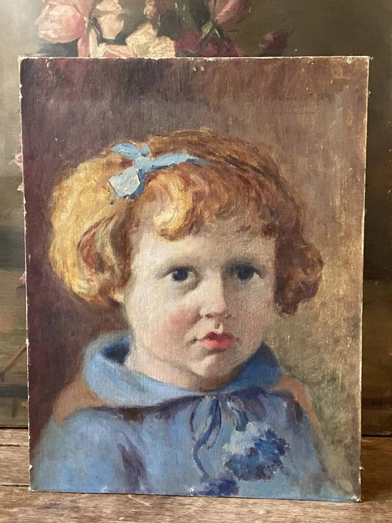 Portrait of a child signed Morin 1922 – oil on mounted panel 29 × 35 cm