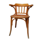Curved wooden armchair