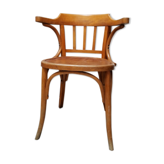 Curved wooden armchair