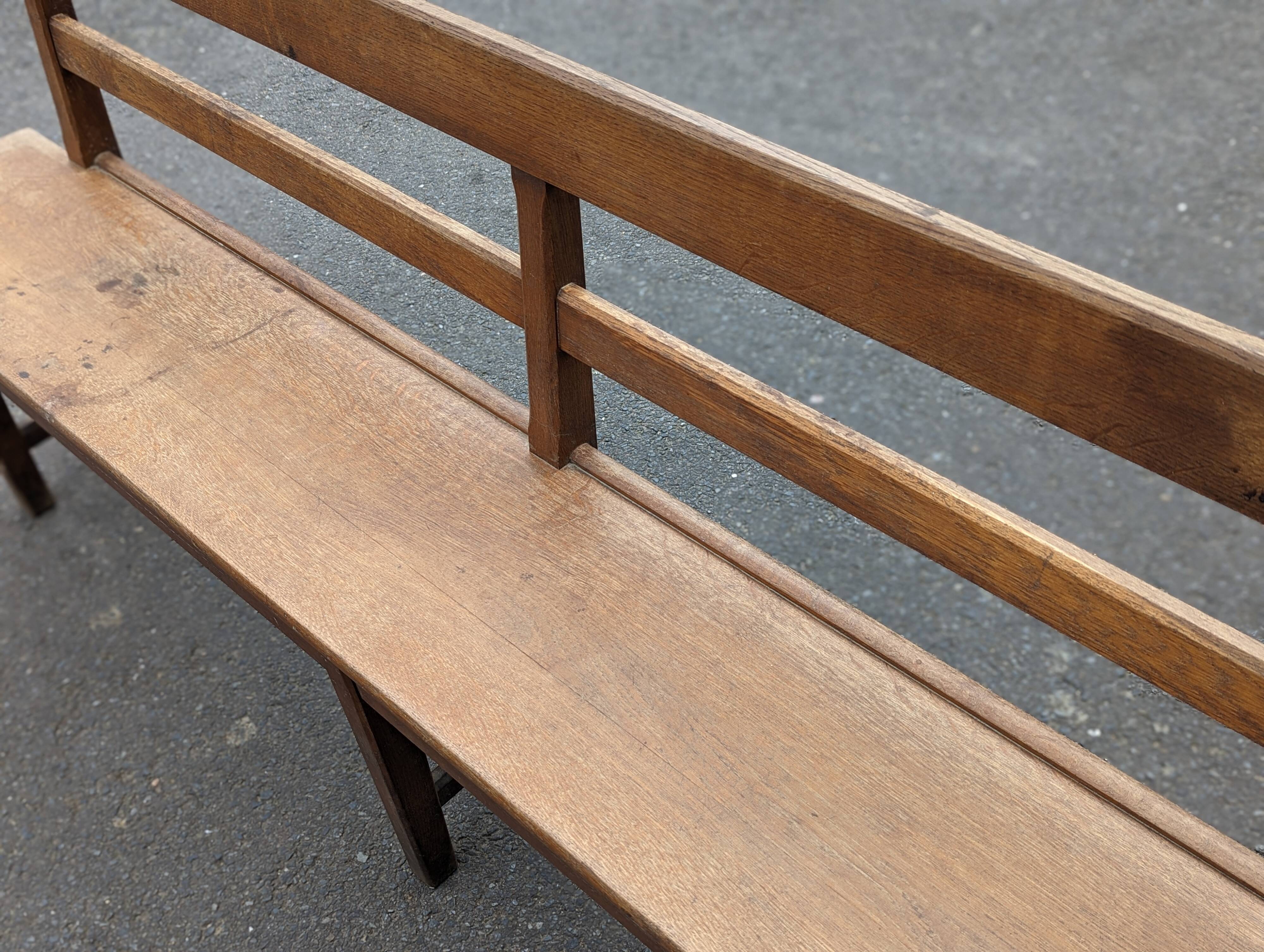 Large oak bench with back