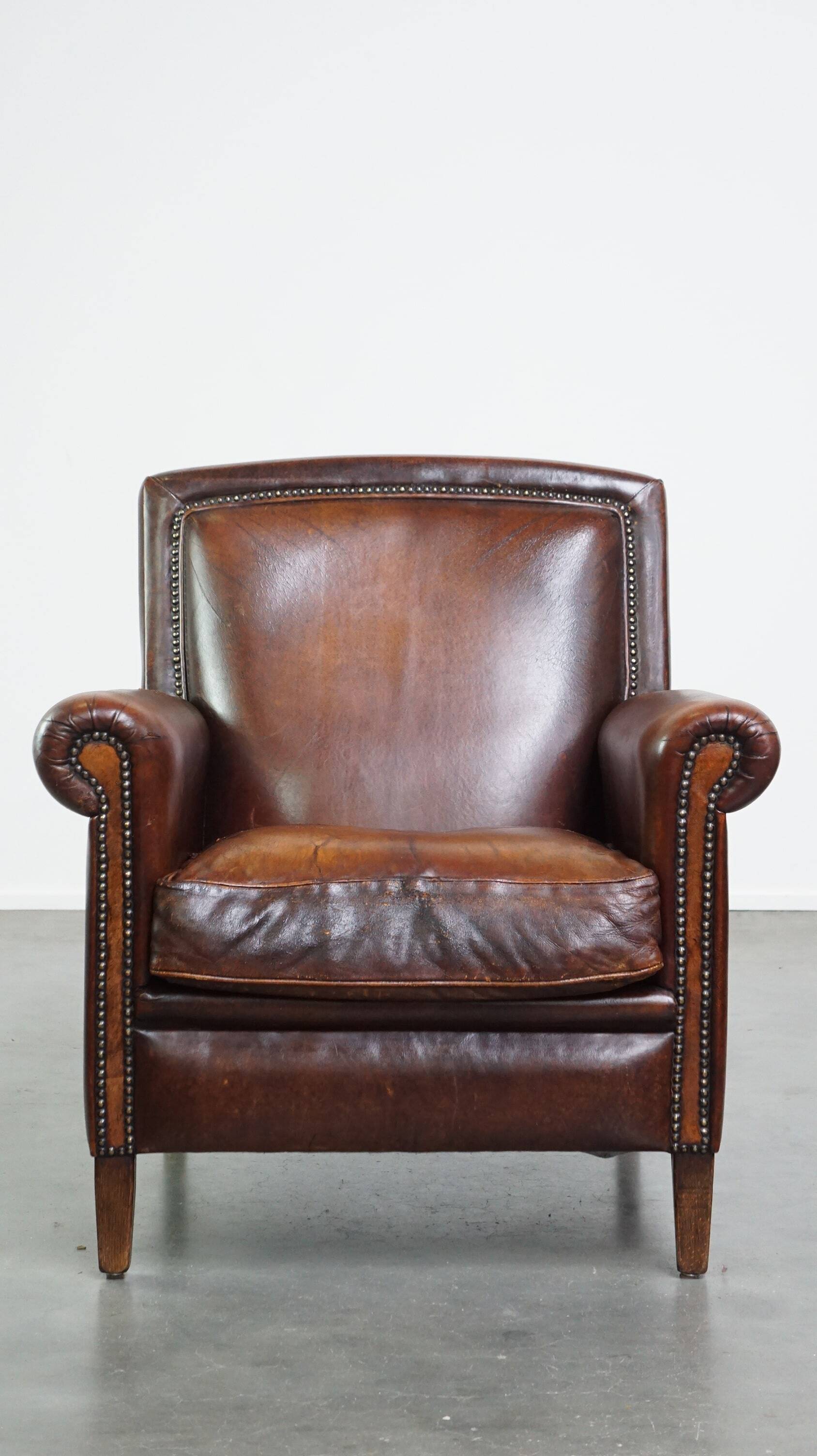 Vintage sheepskin armchair with beautiful warm colors and excellent seating comfort