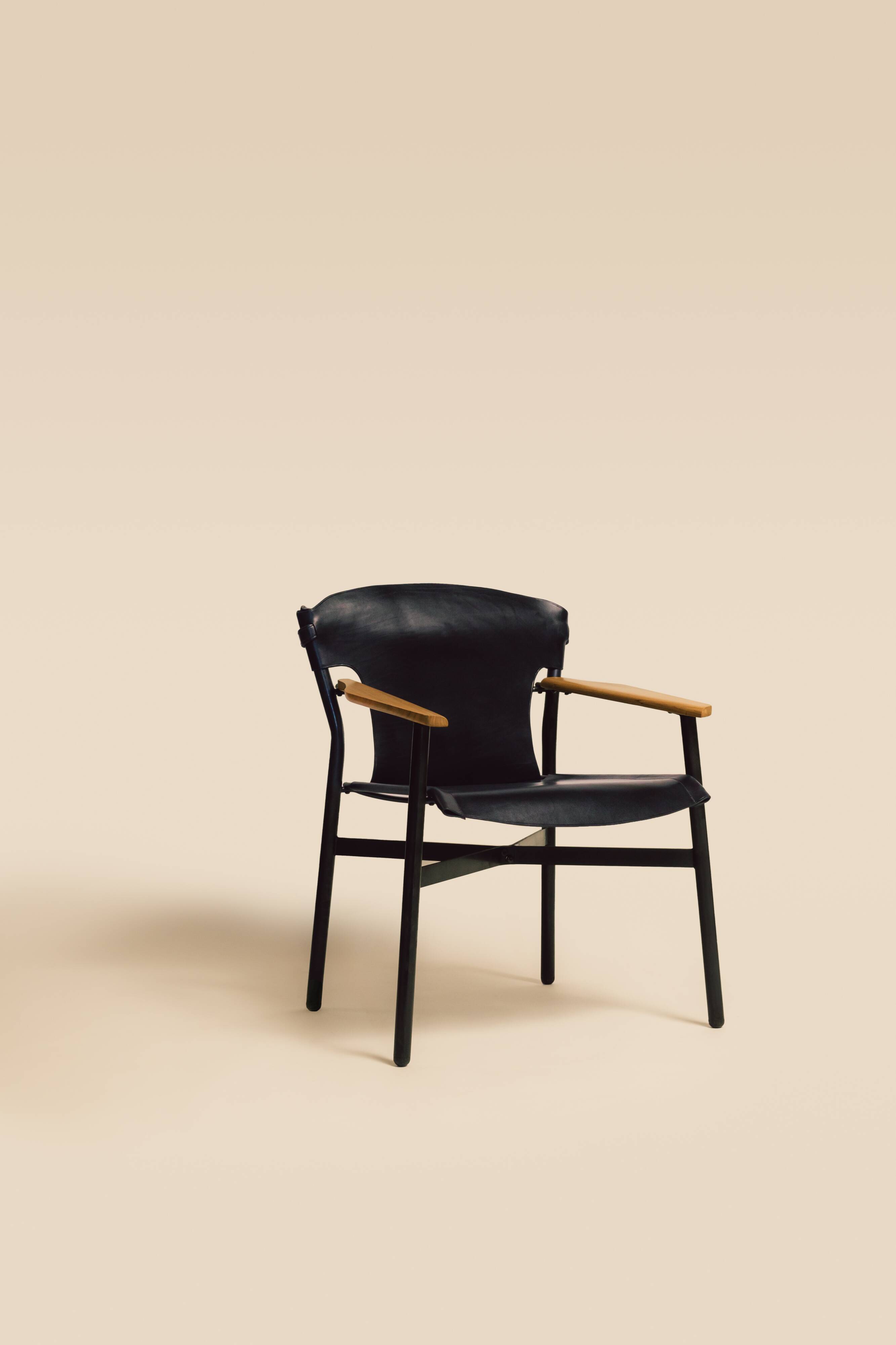 Maërl armchair, Galathée model, black leather, solid wood armrests of your choice