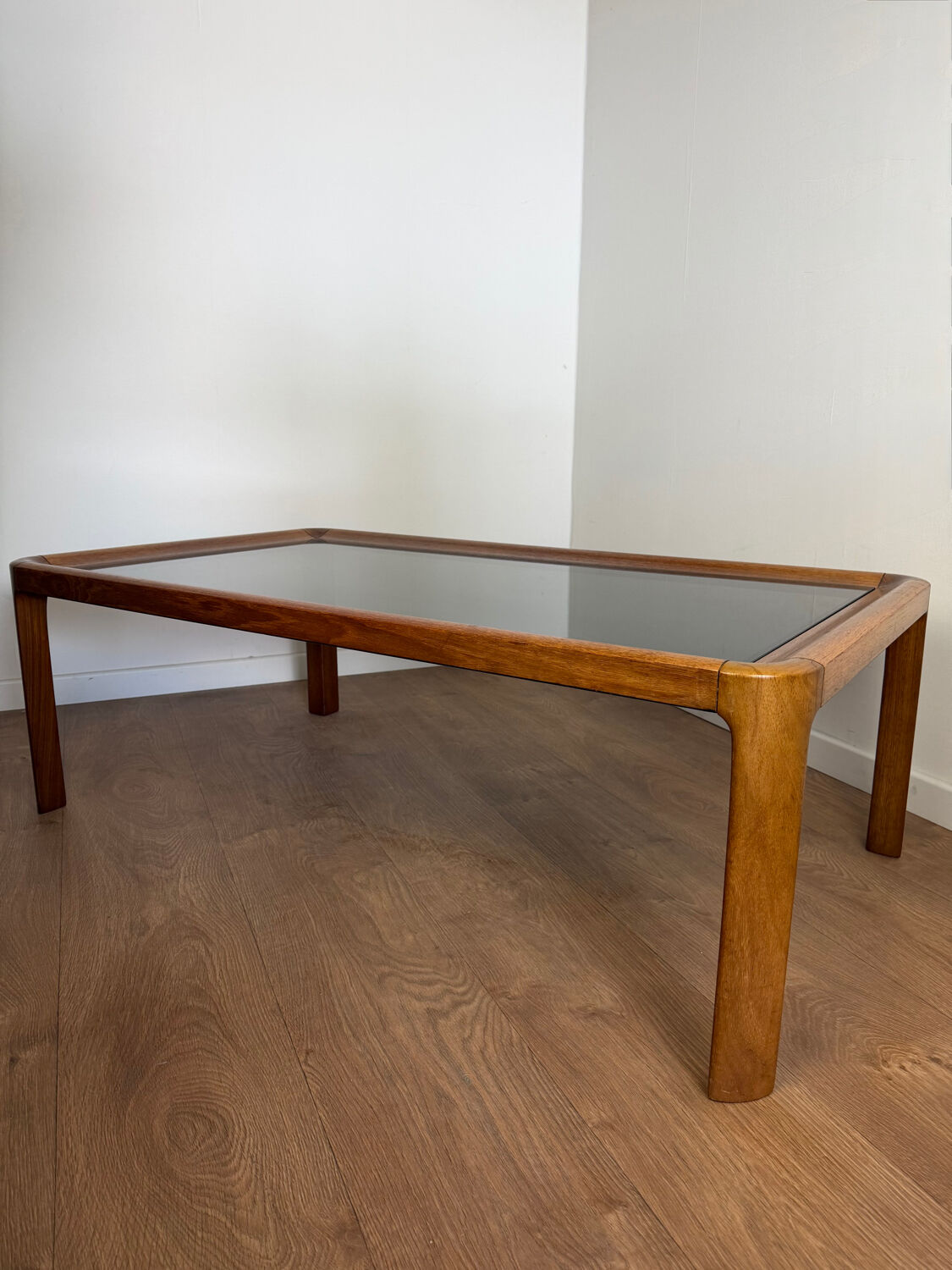 Large Scandinavian coffee table in teak and smoked glass.