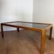 Large Scandinavian coffee table in teak and smoked glass.