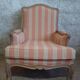 Louis XV bergère style, cerused, reupholstered in coral striped linen – Very good condition.