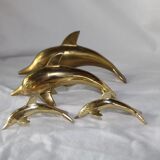 Family of dolphins in vintage brass