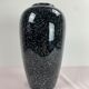 Black and white speckled vase