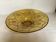 Yellow glass cup with a floral pattern