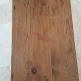 Church bench in fir tree with armrests