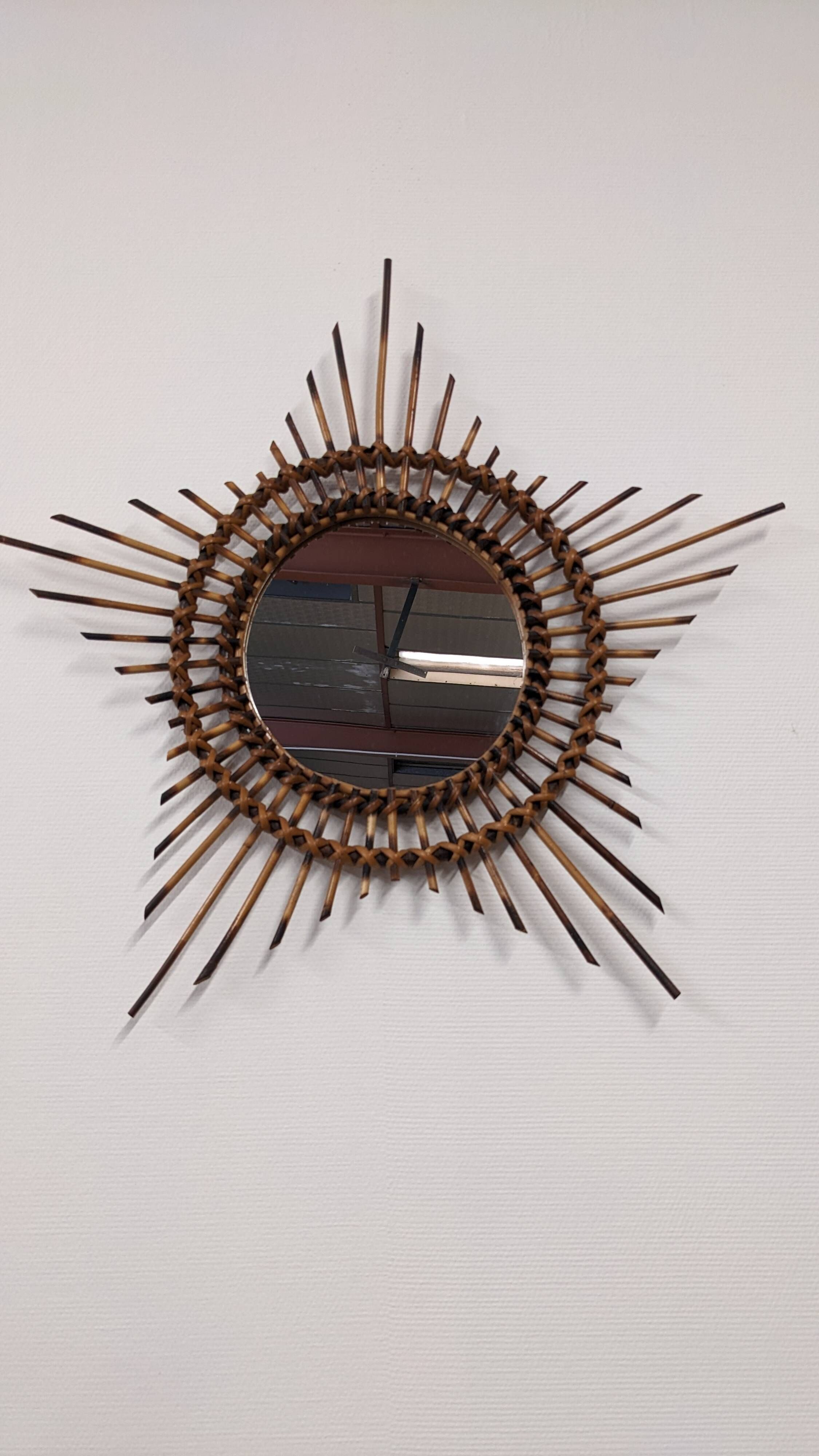 Starry sun mirror in rattan, France around 1960.