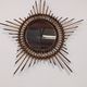 Starry sun mirror in rattan, France around 1960.