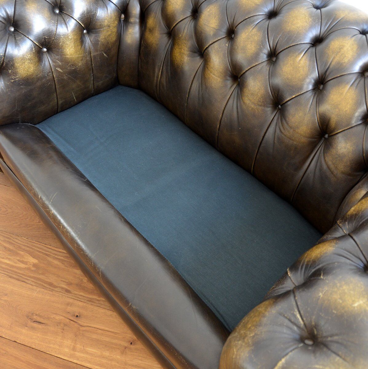 Vintage two-seater leather Chesterfield sofa