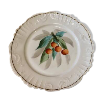old earthenware plate with cherries