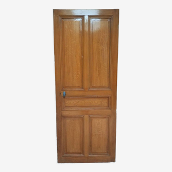 Old communication door with wood effect paint