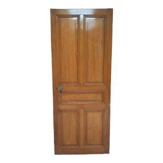 Old communication door with wood effect paint