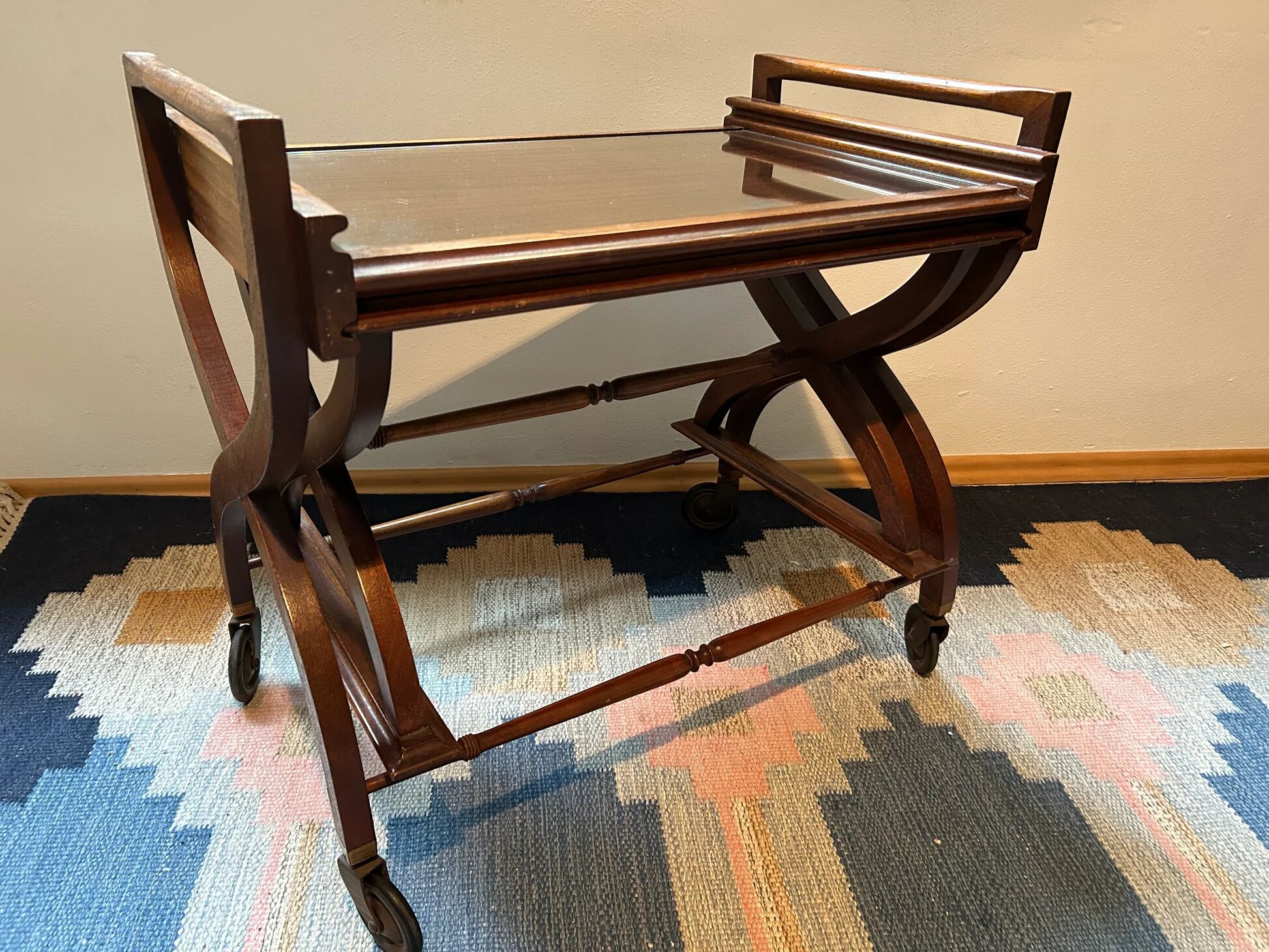 Teak service trolley with nesting table, mid-century modernism.