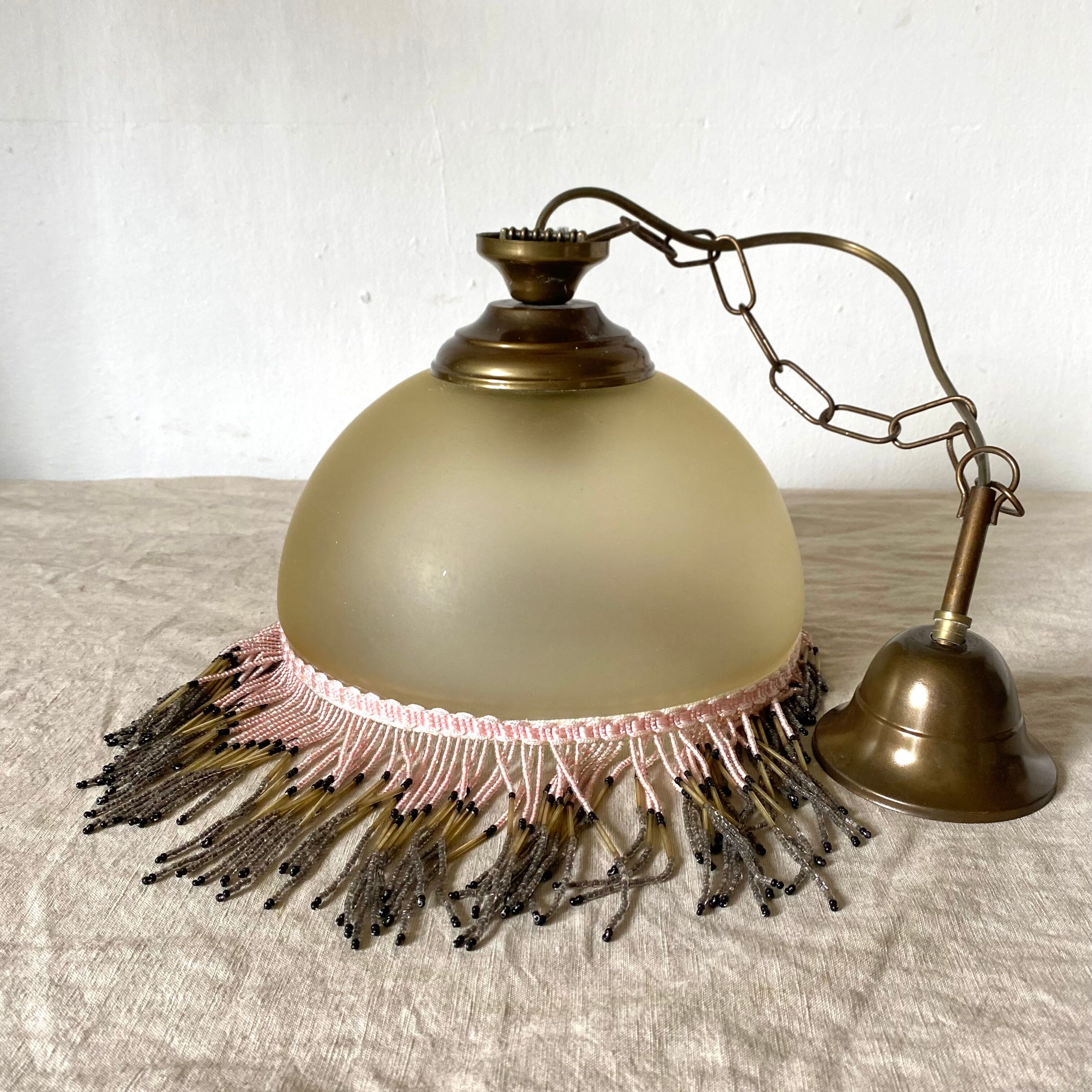 Pendant light in frosted glass and beads