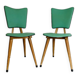 Pairs of green chairs