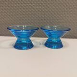 Two small candle holders in blue glass from the well-known Finnish company Ittala.