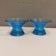 Two small candle holders in blue glass from the well-known Finnish company Ittala.