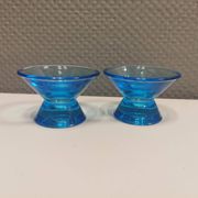 Two small candle holders in blue glass from the well-known Finnish company Ittala.
