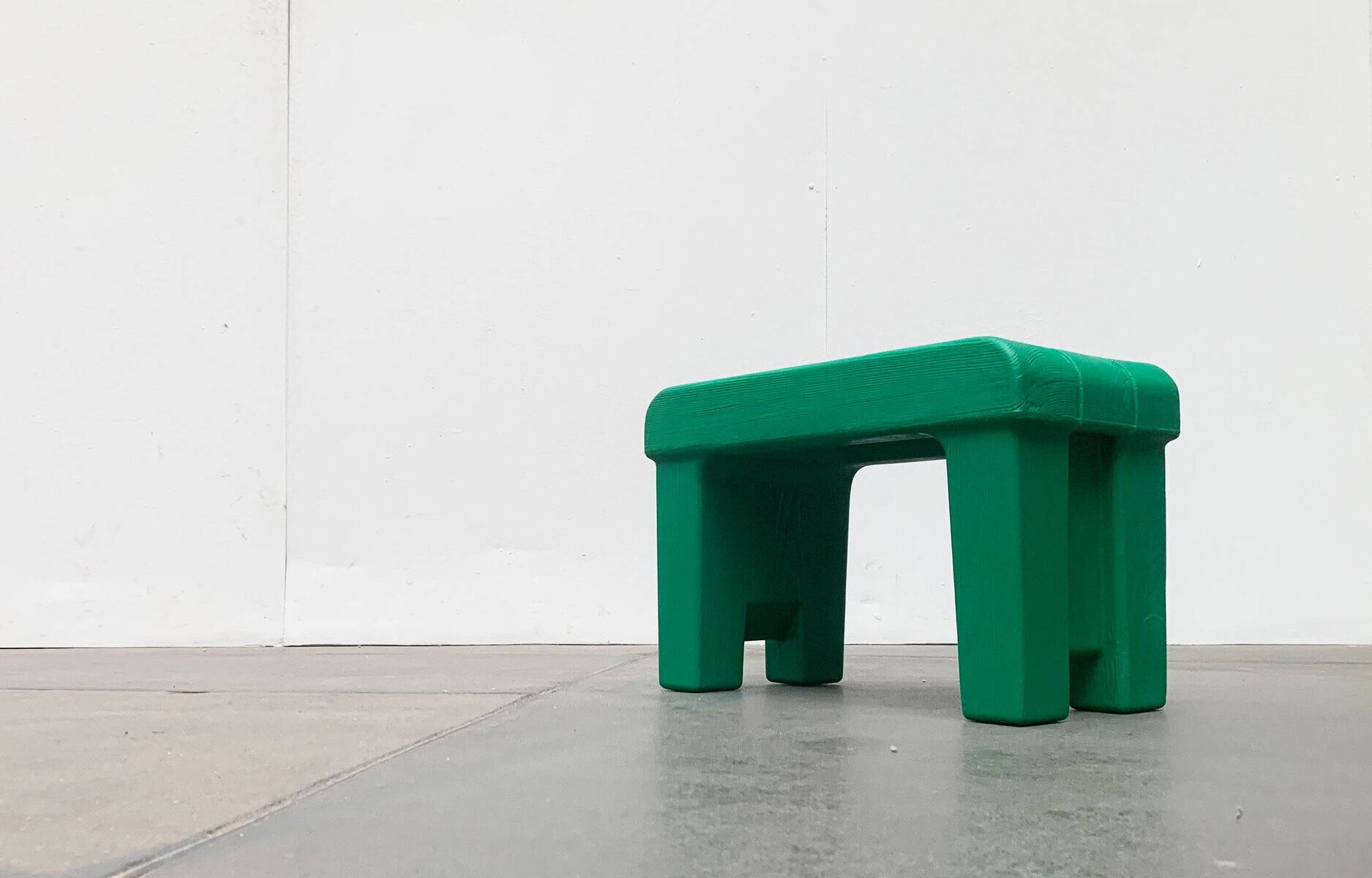 Postmodern plastic stool with a wood effect.